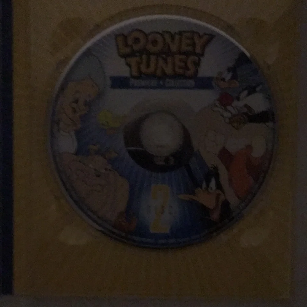 DVD OF LOONEY TUNES SIZES 2 ARE 3 INCH’S TALL